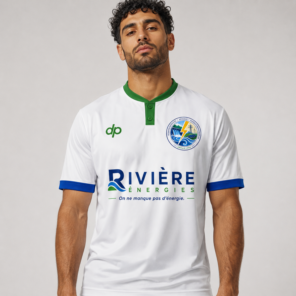 Rivière Énergies white corporate football kit with green and blue trim